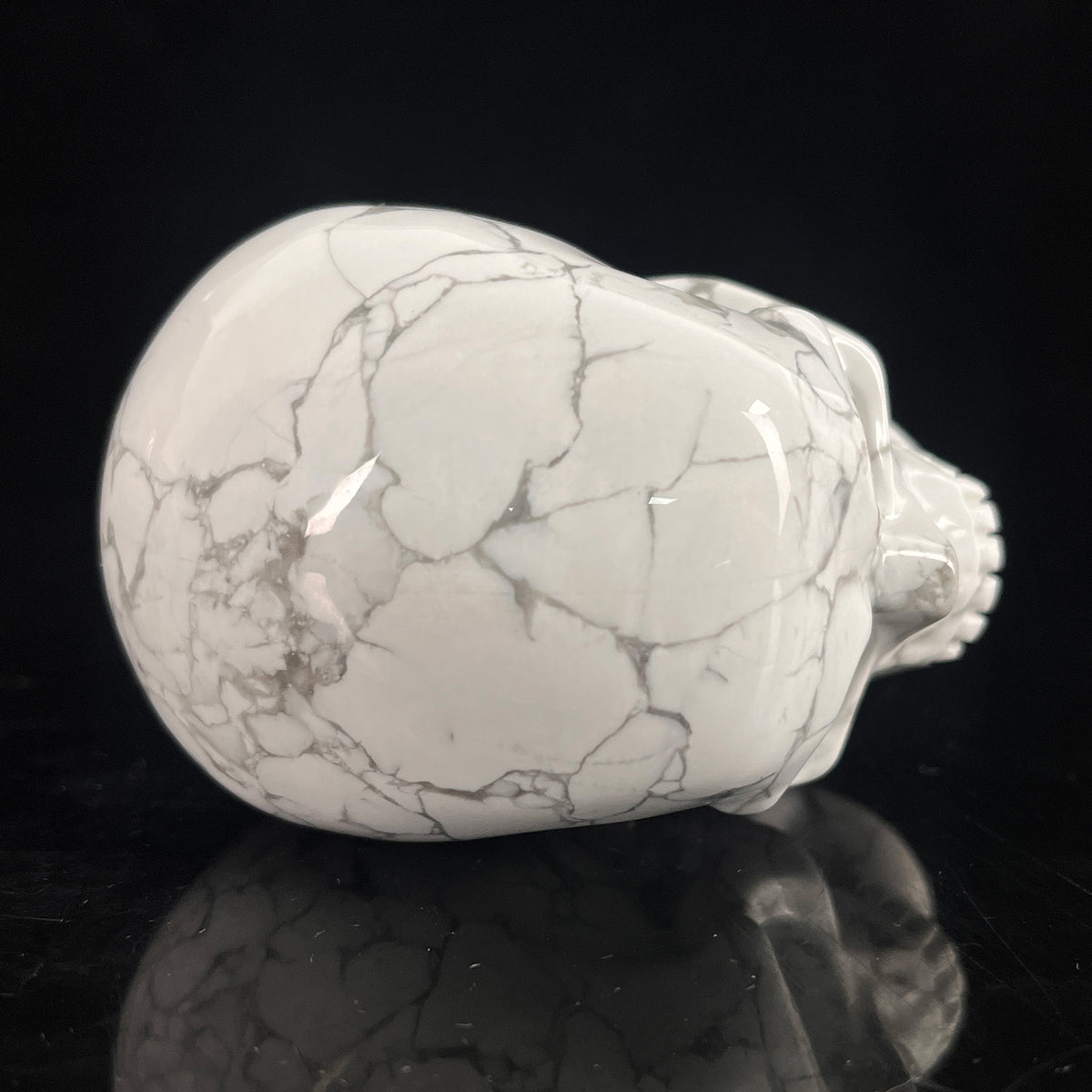 Top view of a 3-inch White Howlite human skull carving