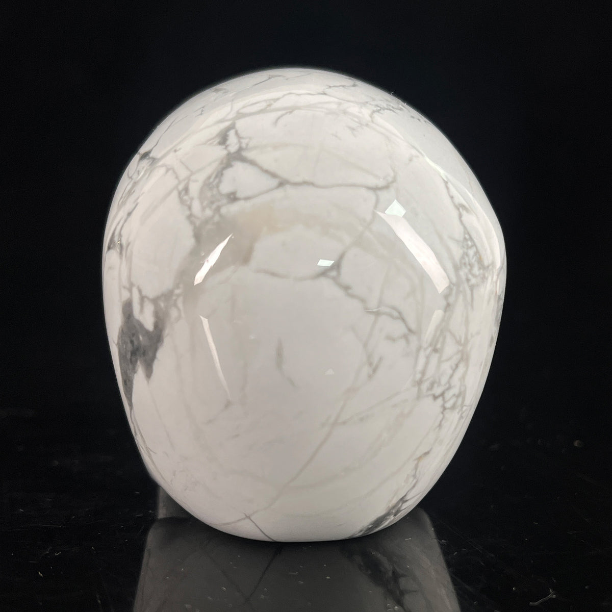 Back view of a 3-inch White Howlite human skull carving