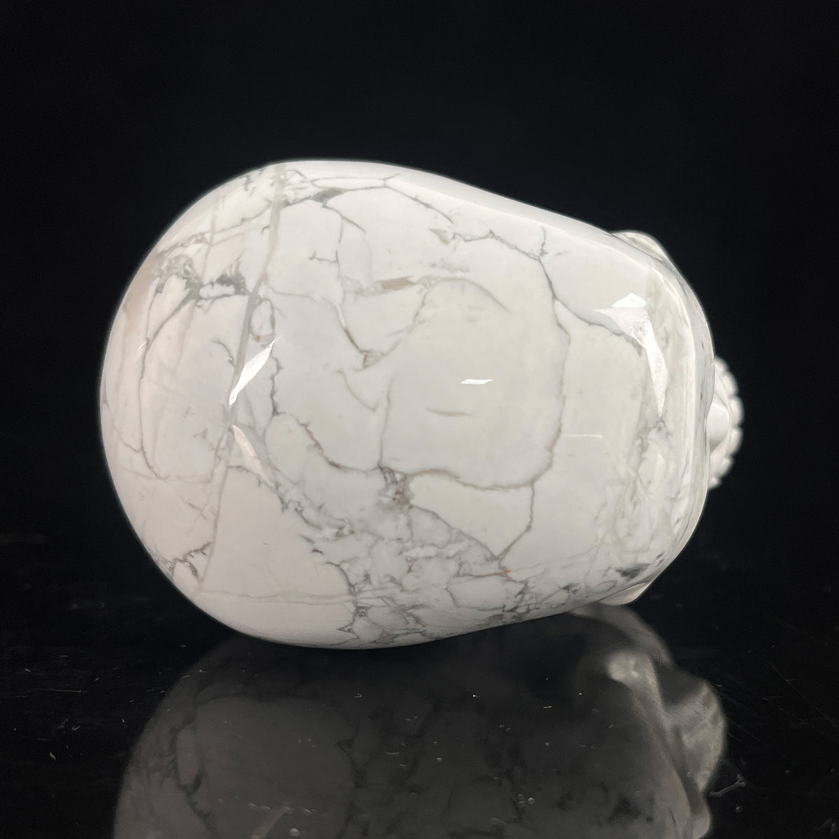 Top view of a 3-inch White Howlite human skull carving