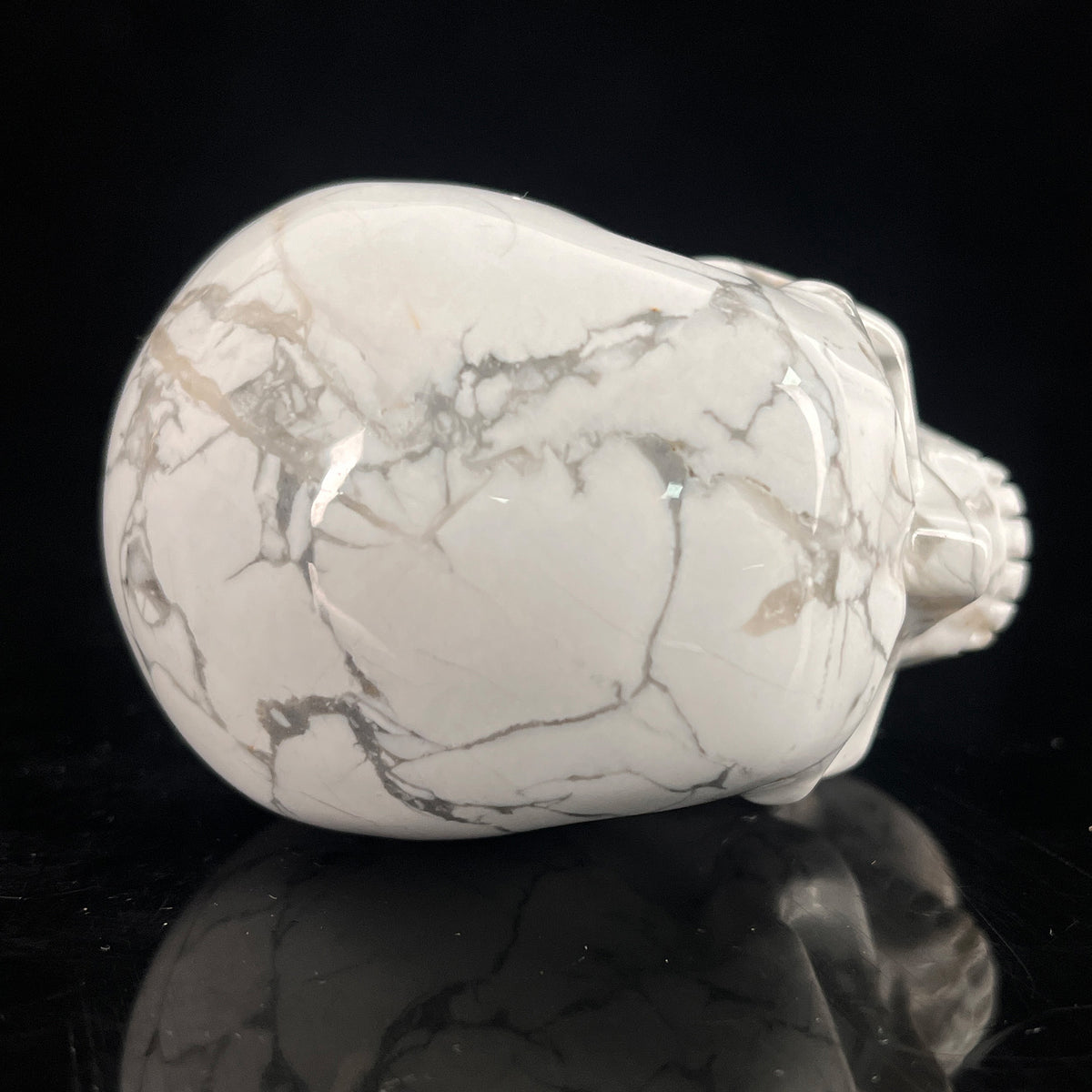 Top view of a 3-inch White Howlite human skull carving