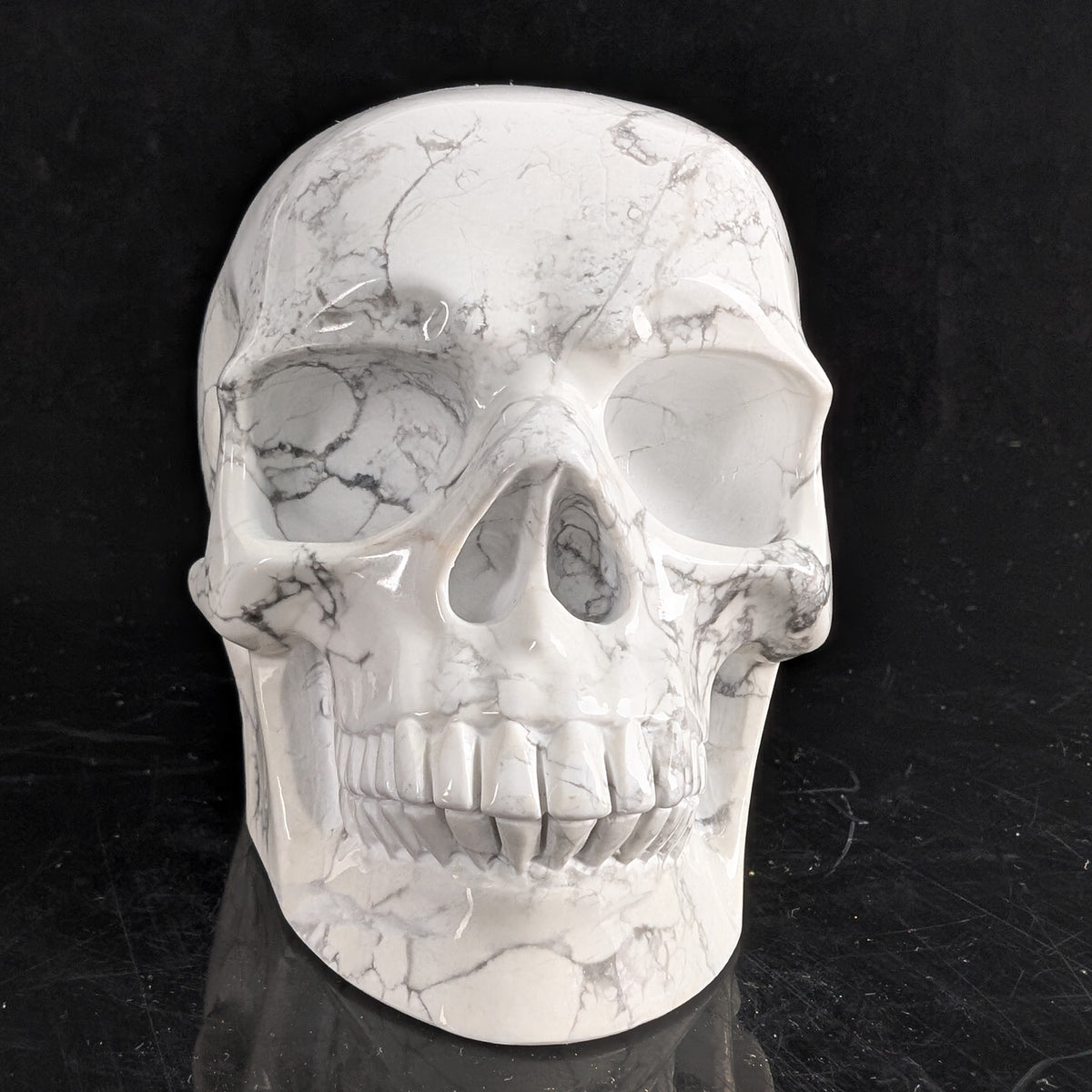 Front view of a 4.5-inch White Howlite human skull carving