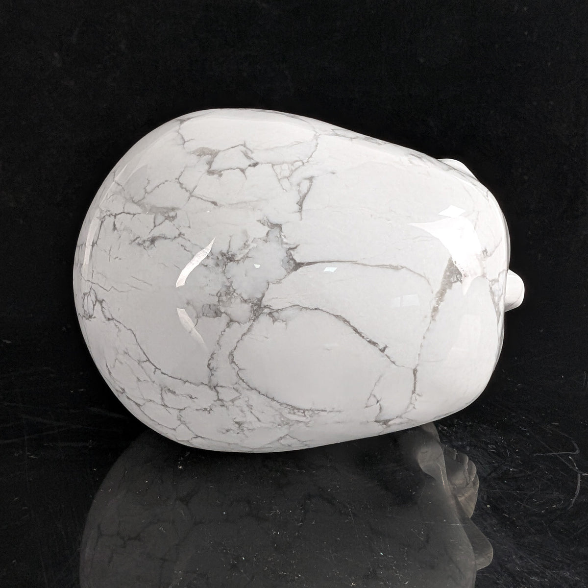 Top view of a 4.5-inch White Howlite human skull carving